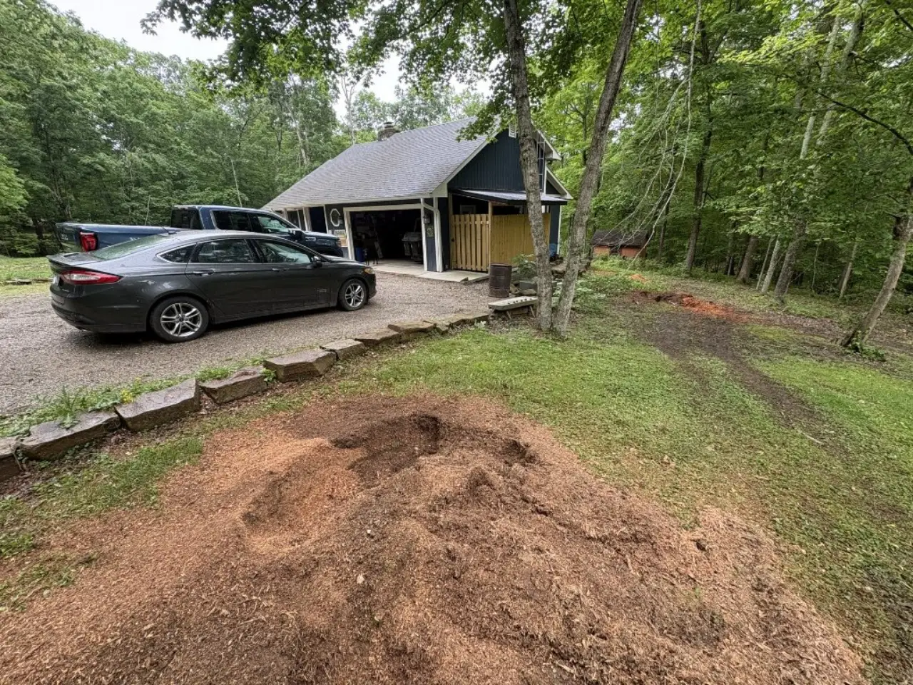 Residential stump grinding cleanup beside a South Central Indiana home